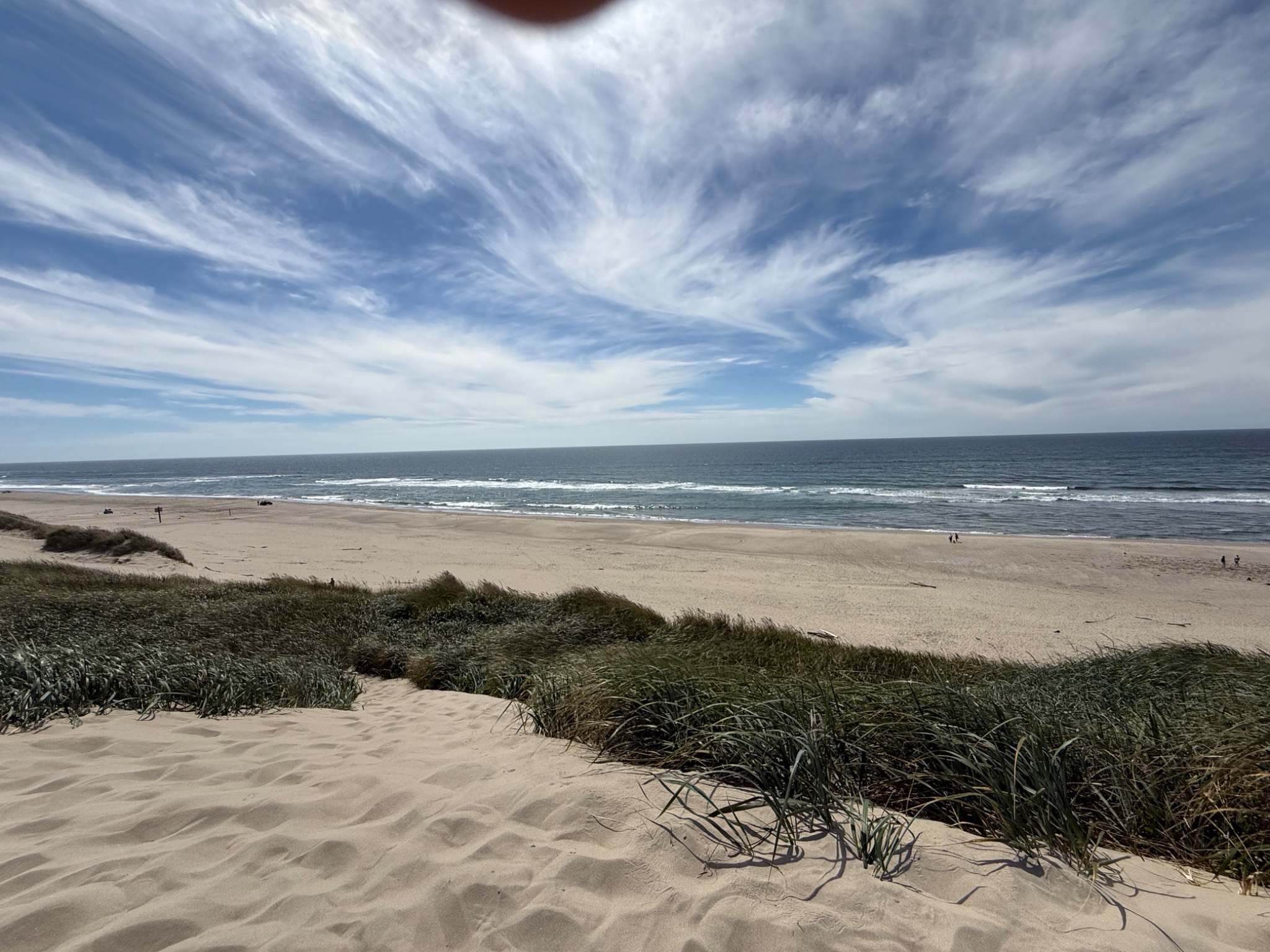 Wide sandy beach beside the ocean